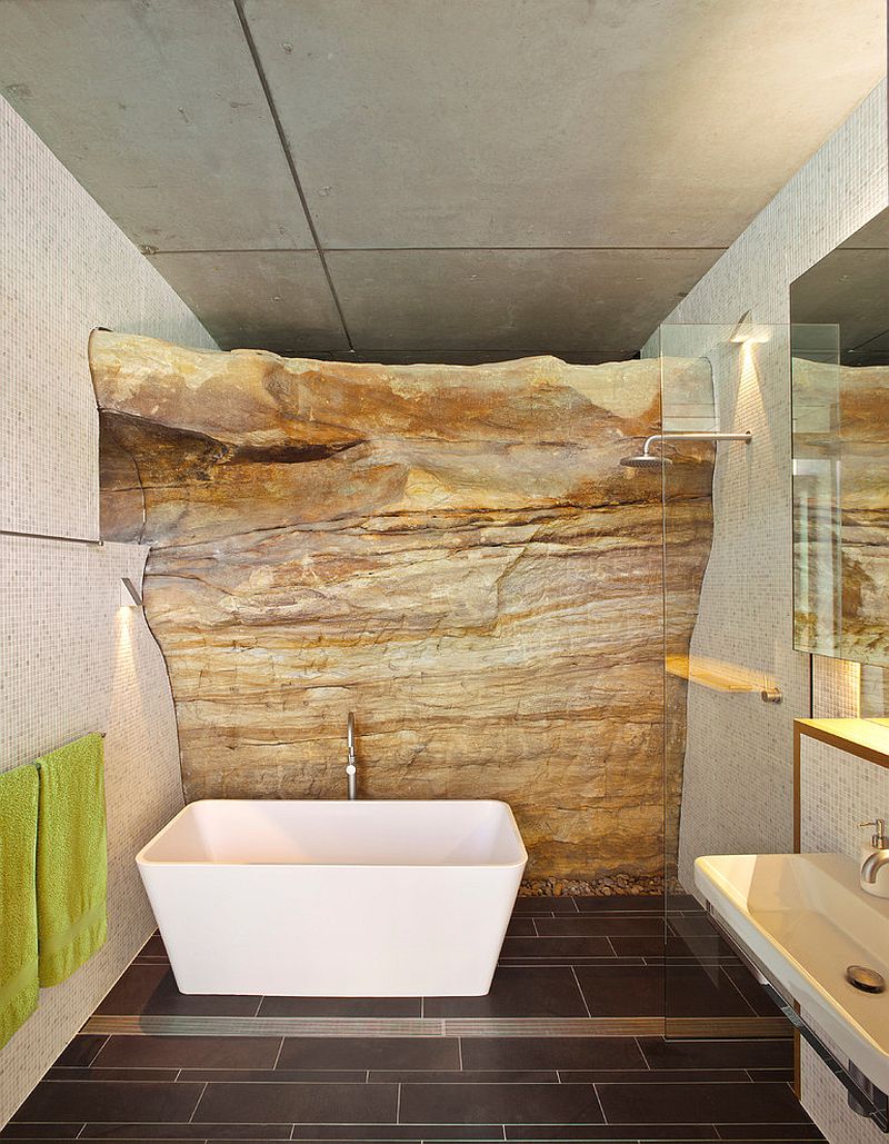 Exposed rock wall beats the traditional use of stones and tiles!