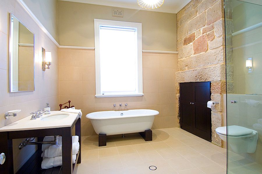 Exposed stone inside the renovated bathroom adds old world charm