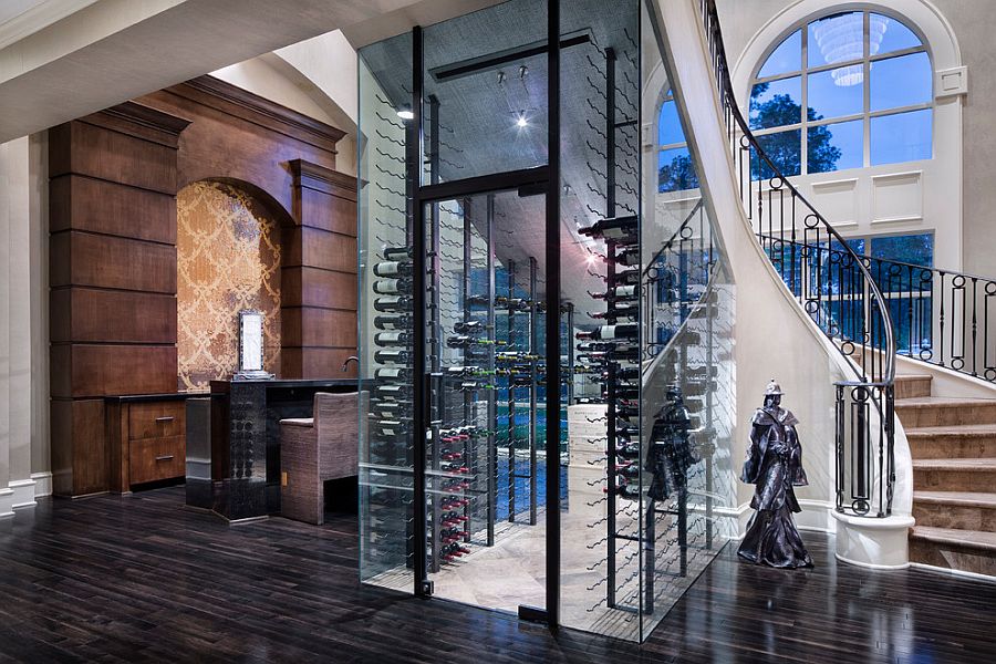 Fabulous wine cellar under the curvy staircase [Design: JAUREGUI Architecture Interiors Construction]