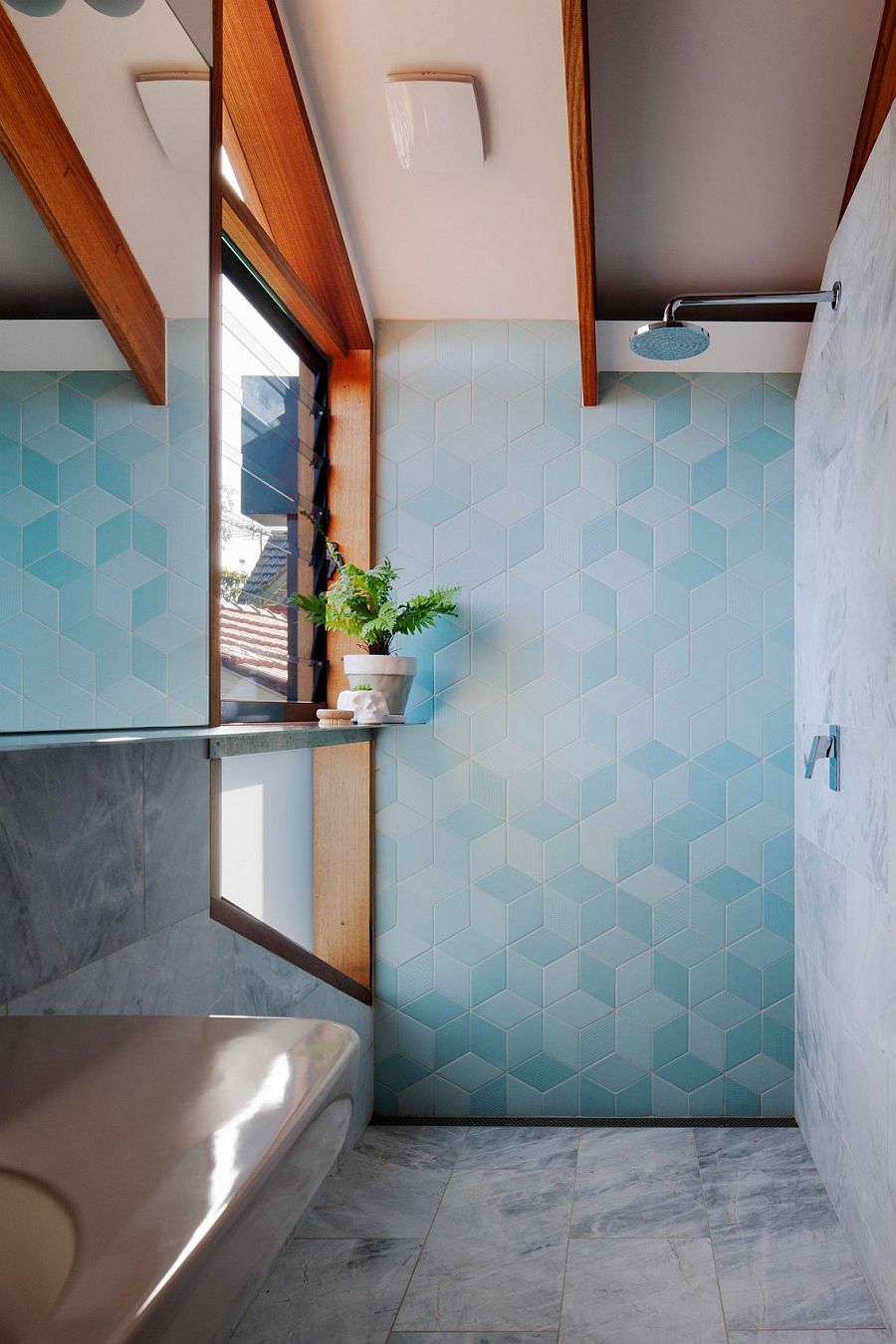 Fascinating use of blue tiles to bring texture and pattern to the modern bathroom