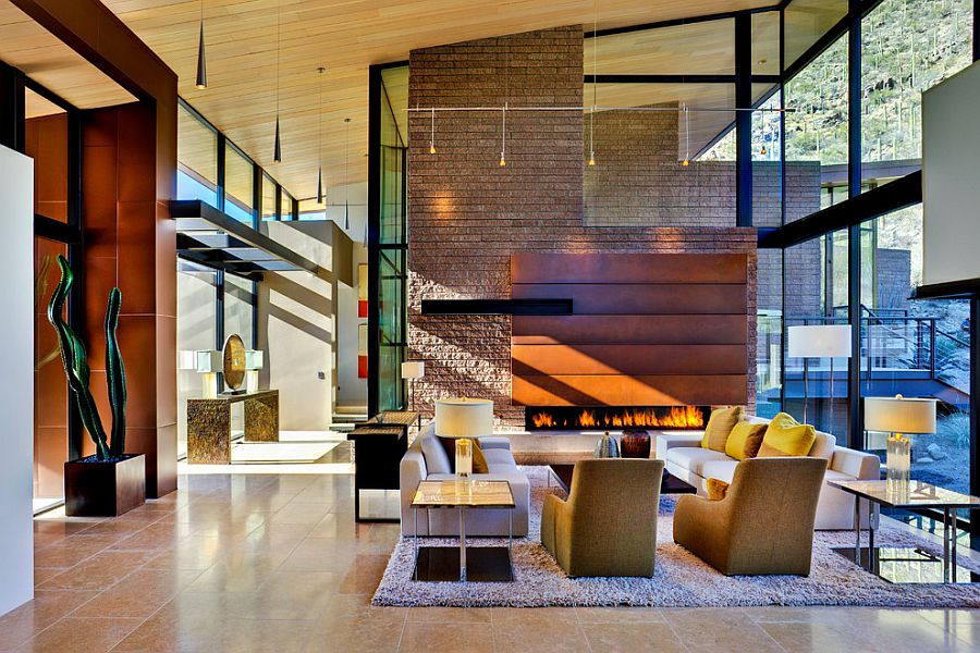 Fireplace creats a warm and elegant focal point in the double hieght living room