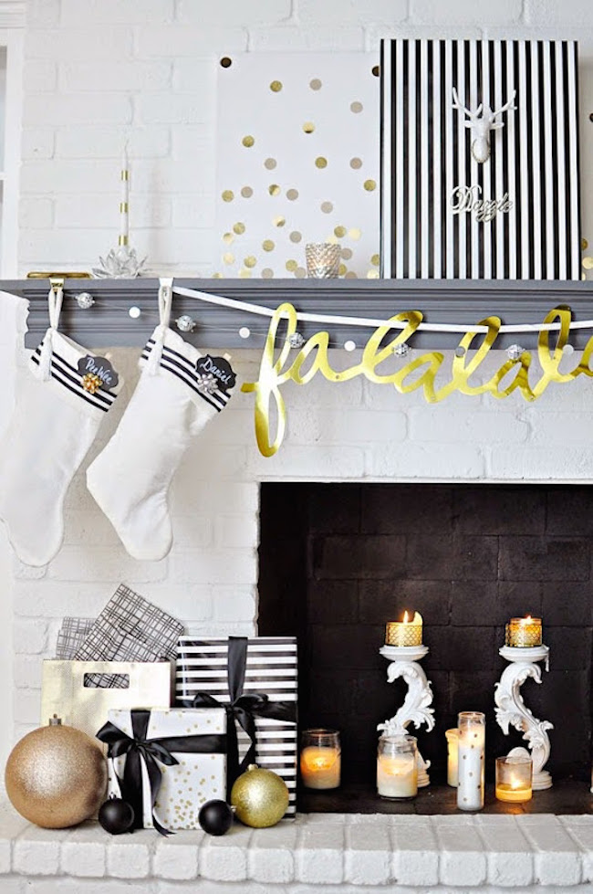 Fireplace mantel with white stockings and gold banner