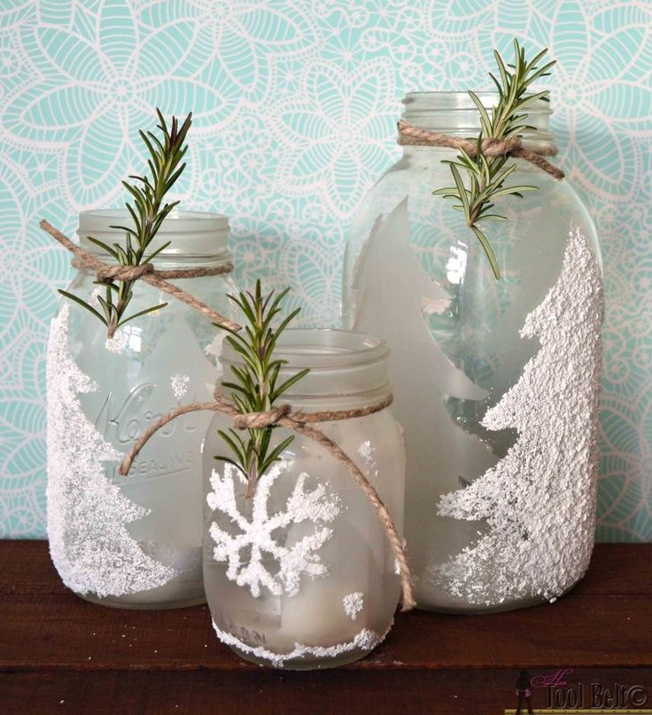 Frosted winter-themed mason jar candle holders with epsom salts