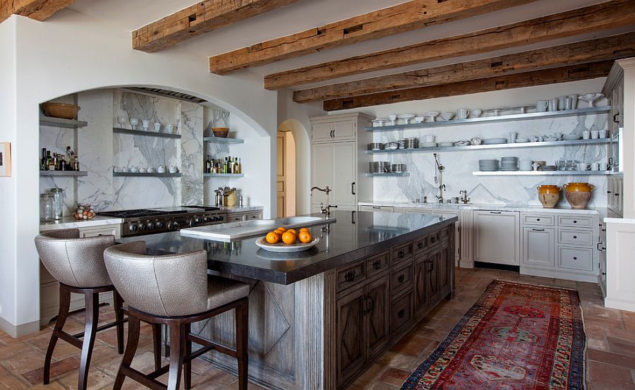 Gorgeous Mediterranean kitchen with antique reclaimed terra cotta flooring and marble counters