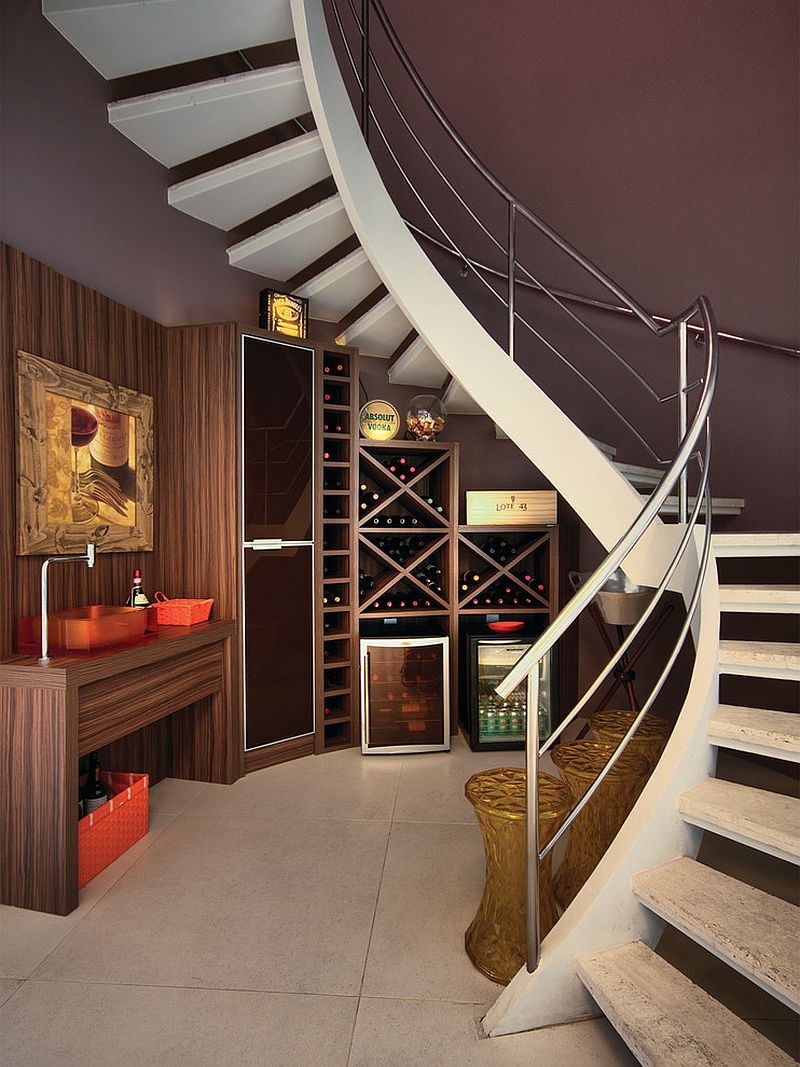 Gorgeous under staircase wine storage idea [Design: Bruno Arquitetura]