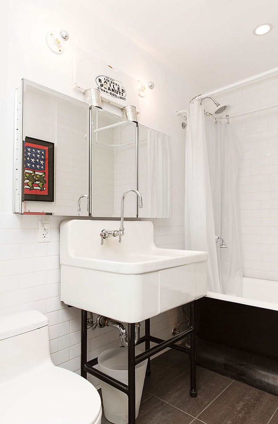 Industrial bathroom in white with vintage bathtub and shower area