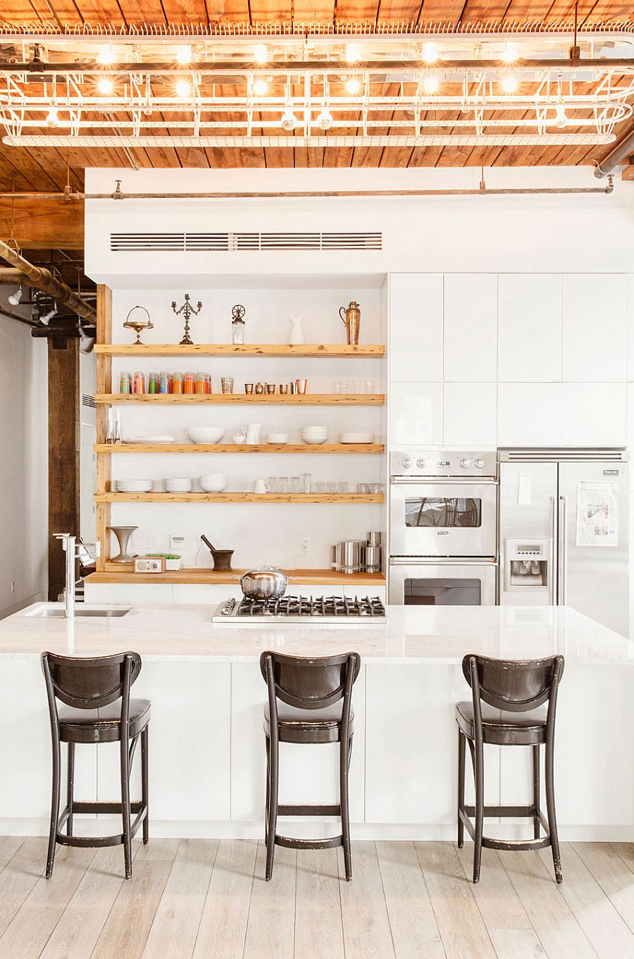 Industrial style kitchen with sleek, open wooden shelves