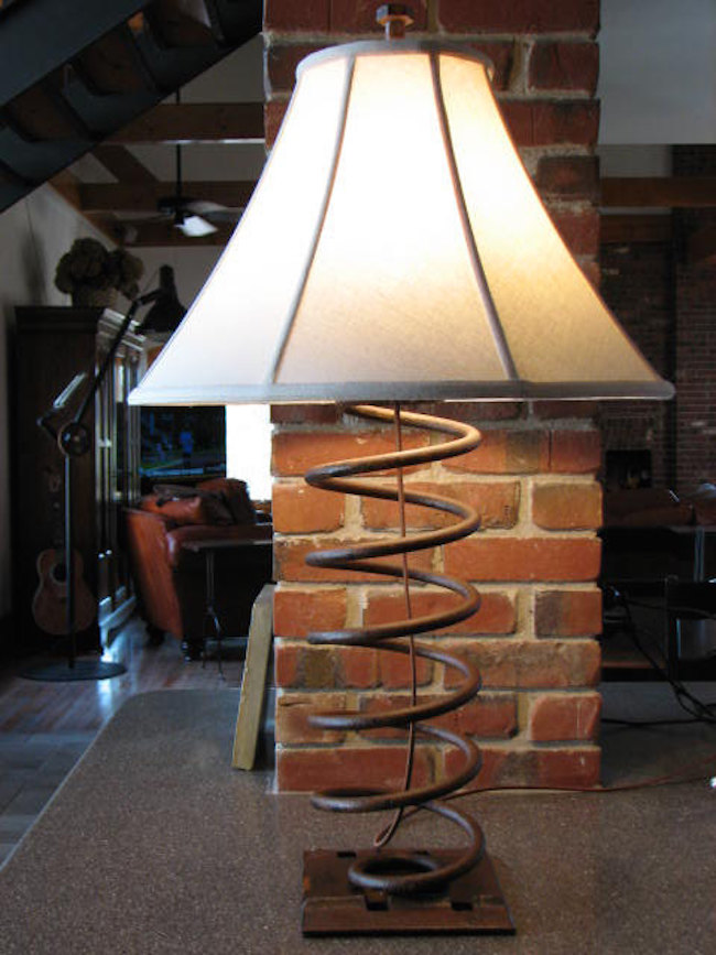 Industrial table lamp made from an old truck spring