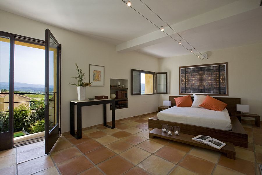 Large terra-cotta tile brings country charm to the luxurious contemporary bedroom