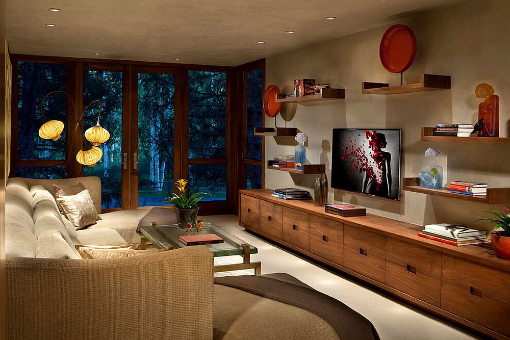 Linear Amerivan Walnut cabinet and floating shelves provide storage and display space in the family room