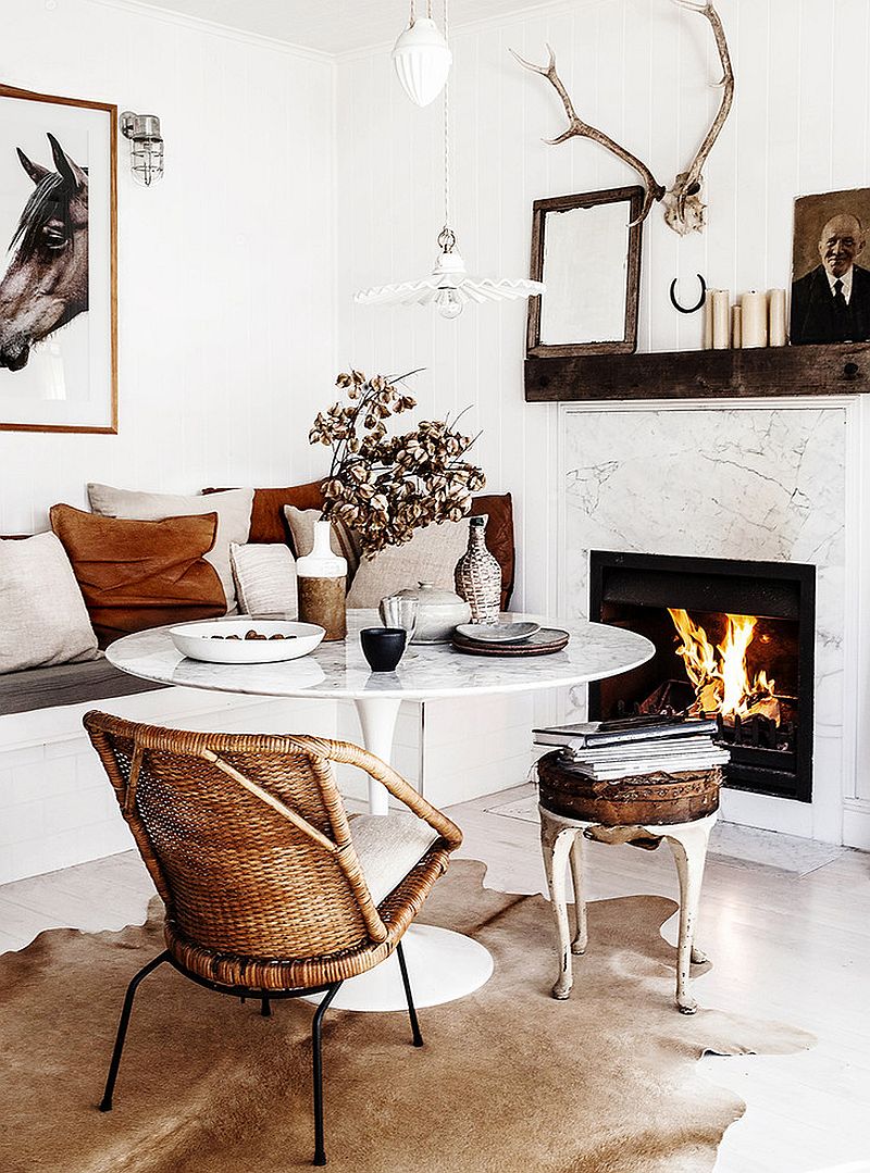 Marble fireplace and Saarinen Tulip Table bring timeless elegance to the dining space [Design: Kara Rosenlund]