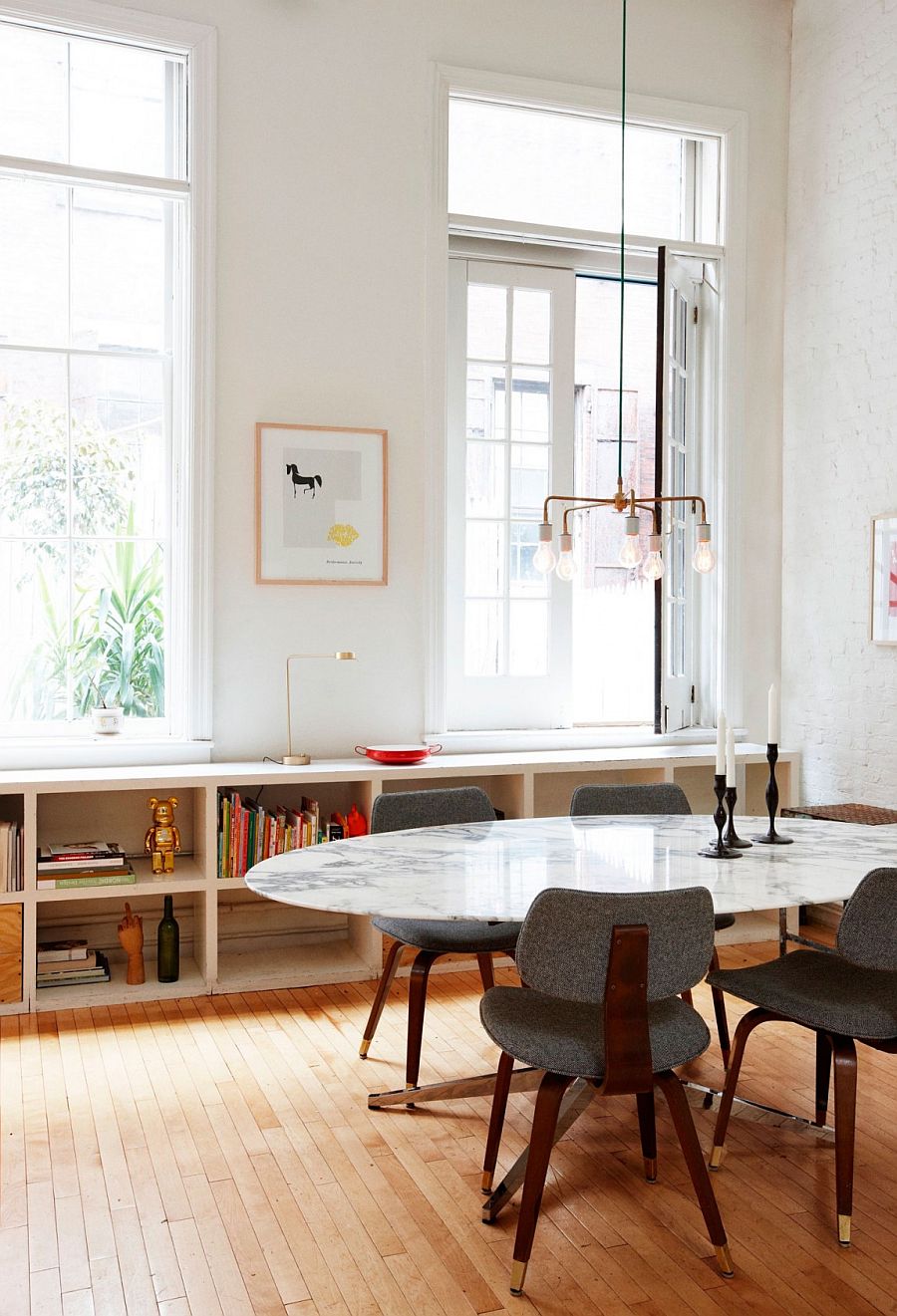 Marble top dining table gives the interior a glamorous facelift