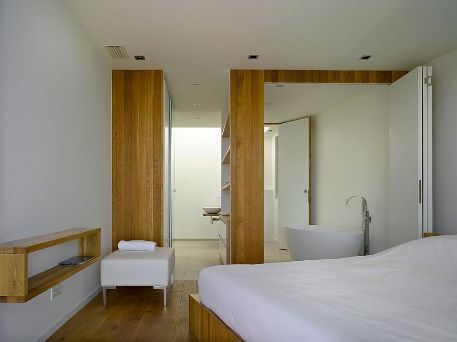 Master bedroom and bathroom become one with the use of stackable doors