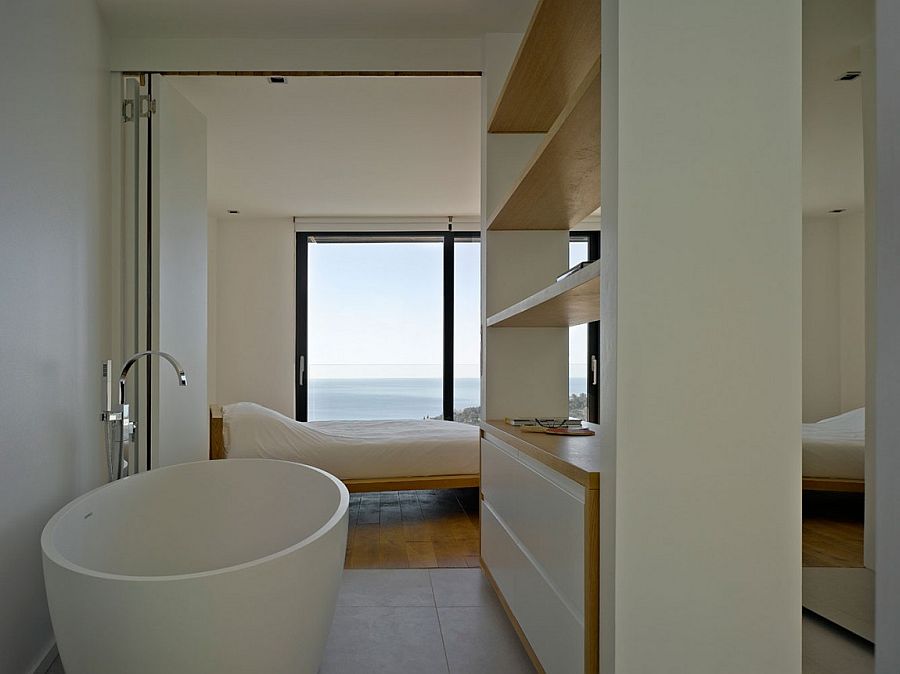 Master suite of the French villa with a view of the distant sea