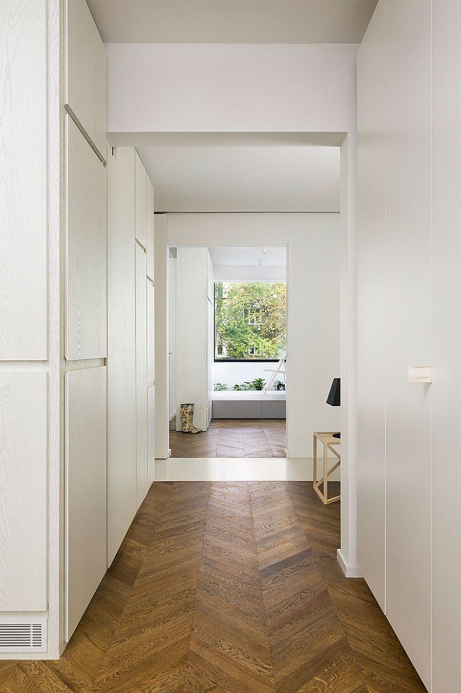 Minimal shelves and chevron patterm flooring for the smart apartment