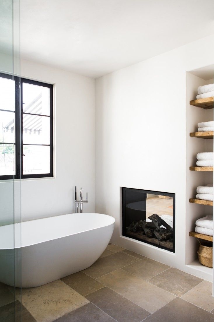 Modern bathroom with dual fireplace