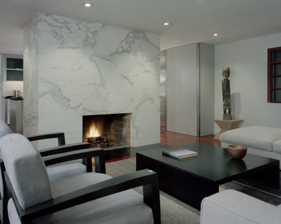 Modern living room with a sleek marble fireplace