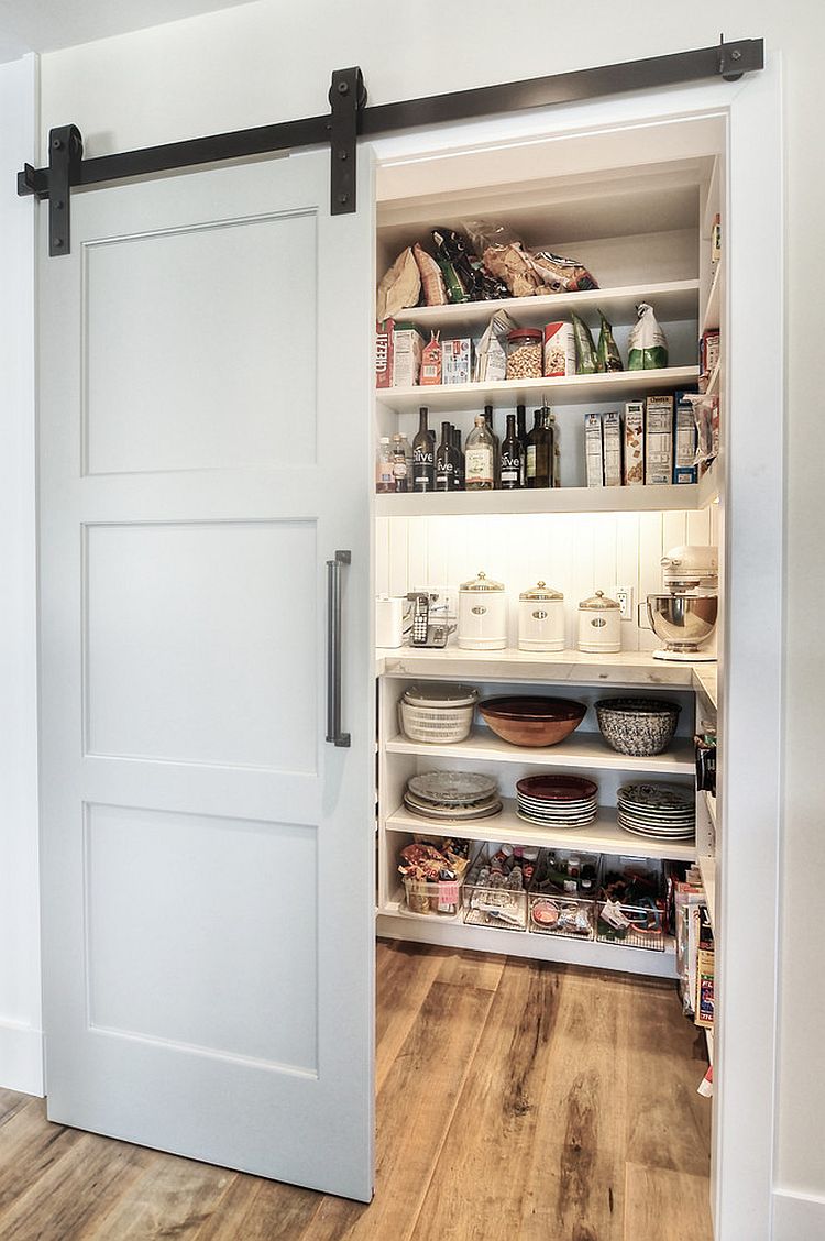 Modern pantry design with an elegant sliding barn door