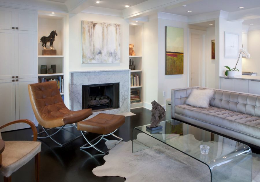 Modern white living room with a marble fireplace