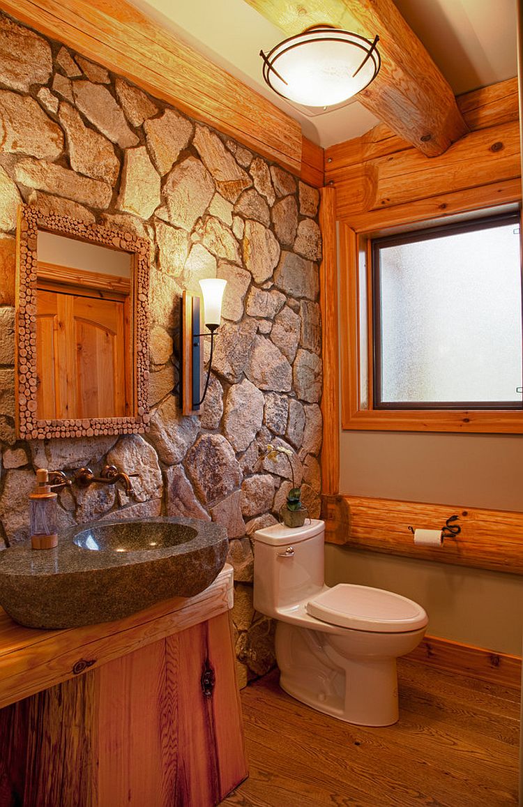 Natural stone wall for the cabin style rustic bathroom [Design: Traditional Log Homes Ltd]