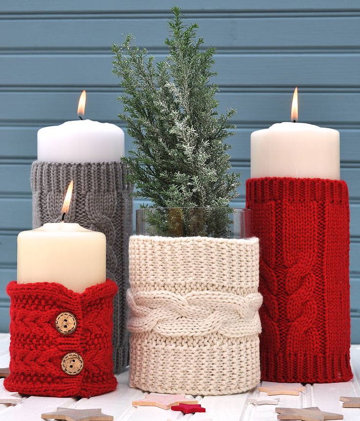 Pillar candles with knitted sweater sleeves