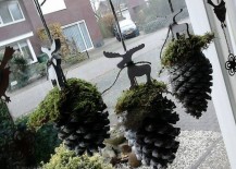 Pinecones-with-moss-and-reindeer-figurines-hung-in-window-217x155