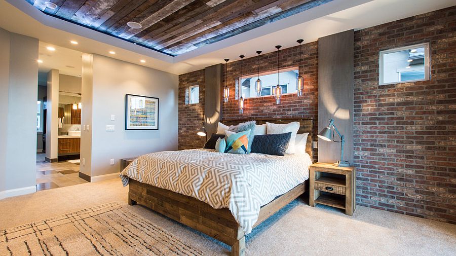 Reclaimed wood ceiling and exposed brick walls in the bedroom [Design: Canyon River Homes]