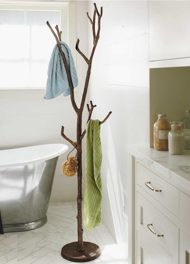 Recycled metal branch coat tree in bathroom