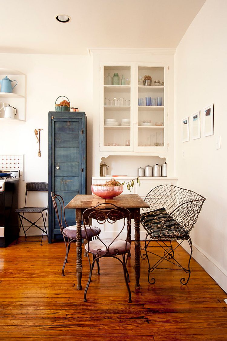 Repainted vintage cabinet, reclaimed decor and fabulous furniture shape the smart dining room