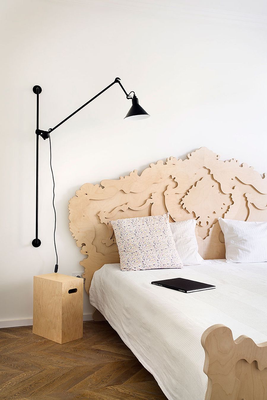 Sconce lighting fixture used as space-saving bedside light