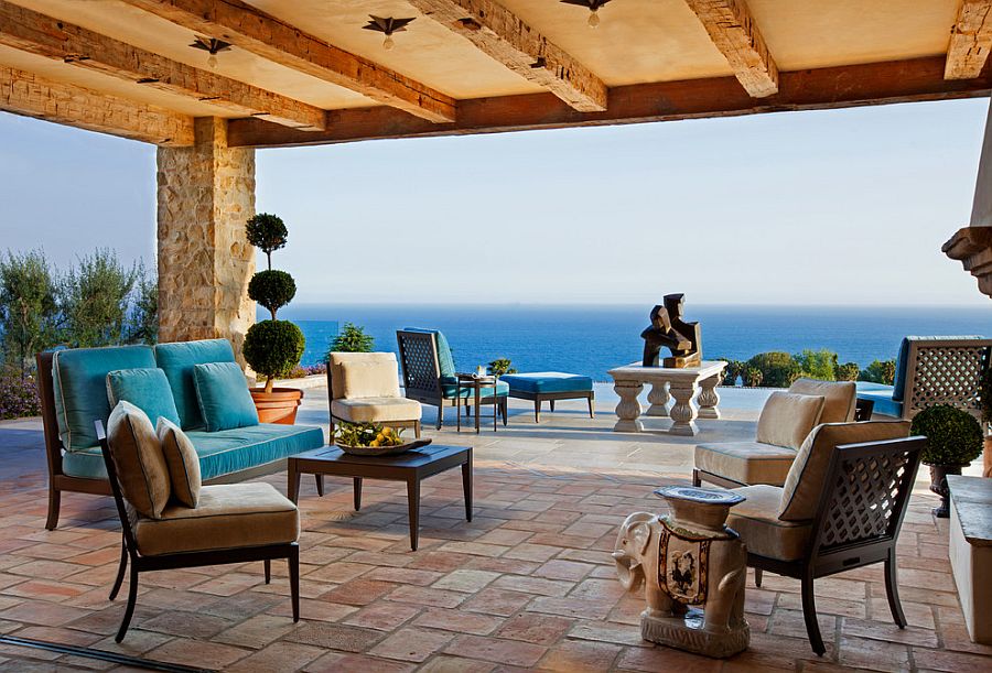 Shaded Mediterranean patio with pool area and ocean views