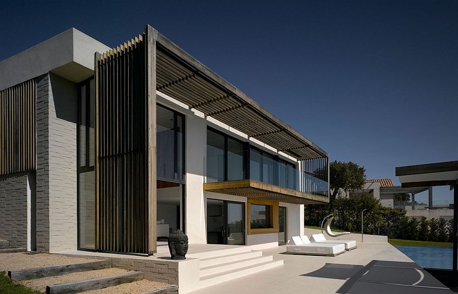 Shaded structure of the house serves as a lovely pergola on hot summer days