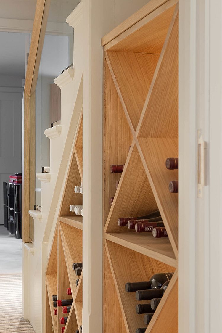 Simple wine storage idea for the small space under the modern staircase [Design: Nash Baker Architects]