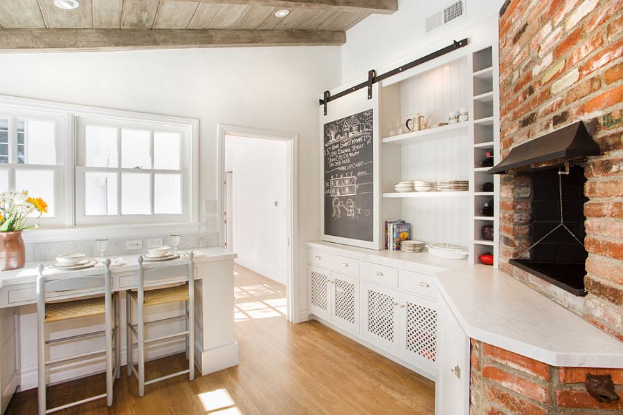 Sliding chalkboard barn door for the kitchen cabinet [Design: Tal Naor and Thea segal / Photography Dana Miller]