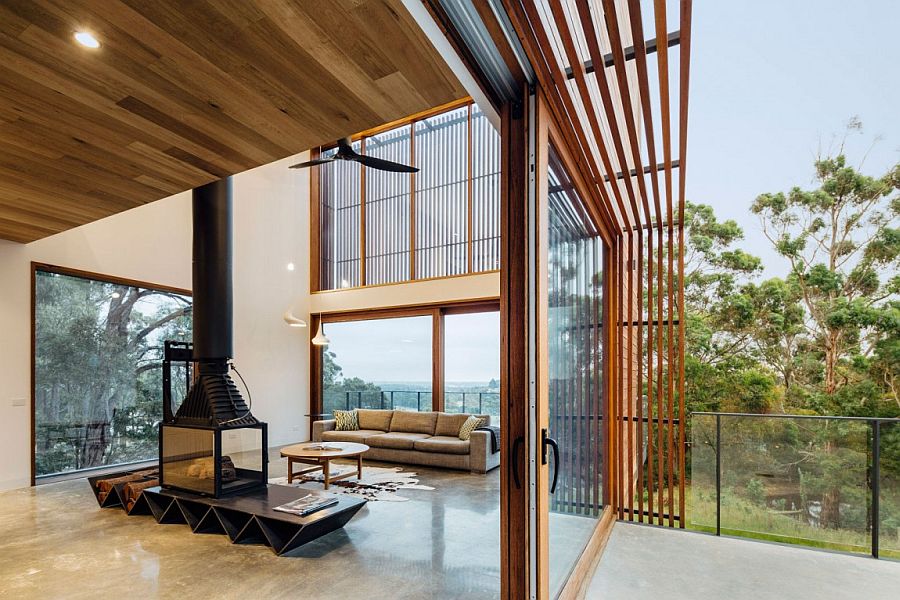 Sliding glass doors connects the living area with the small deck outside