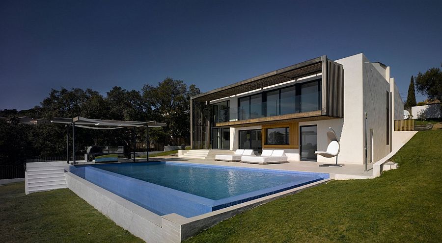 Sloped landscape reveals the gradual levels of the classy, modern villa