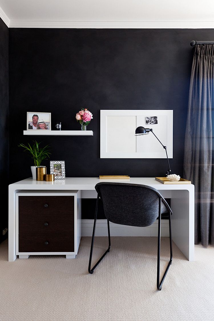 Small home workspace with a dark backdrop and sleek desk in white [Design: HC Interiors]