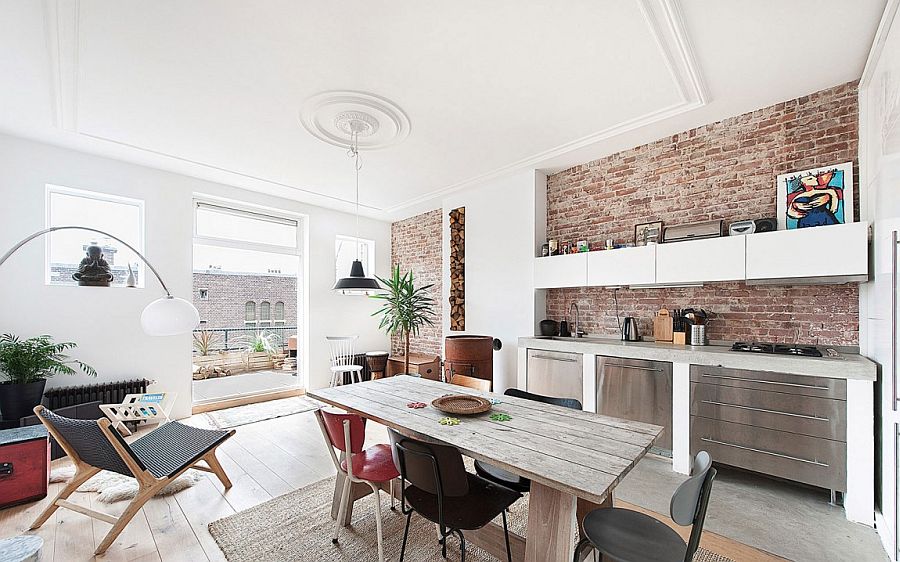 Small kitchen and dining area with exposed brick walls