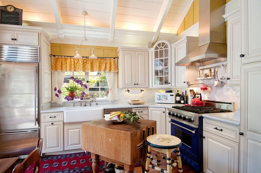 Small shabby chic kitchen with an innovative butcher block island [Design: Debra Campbell Design]