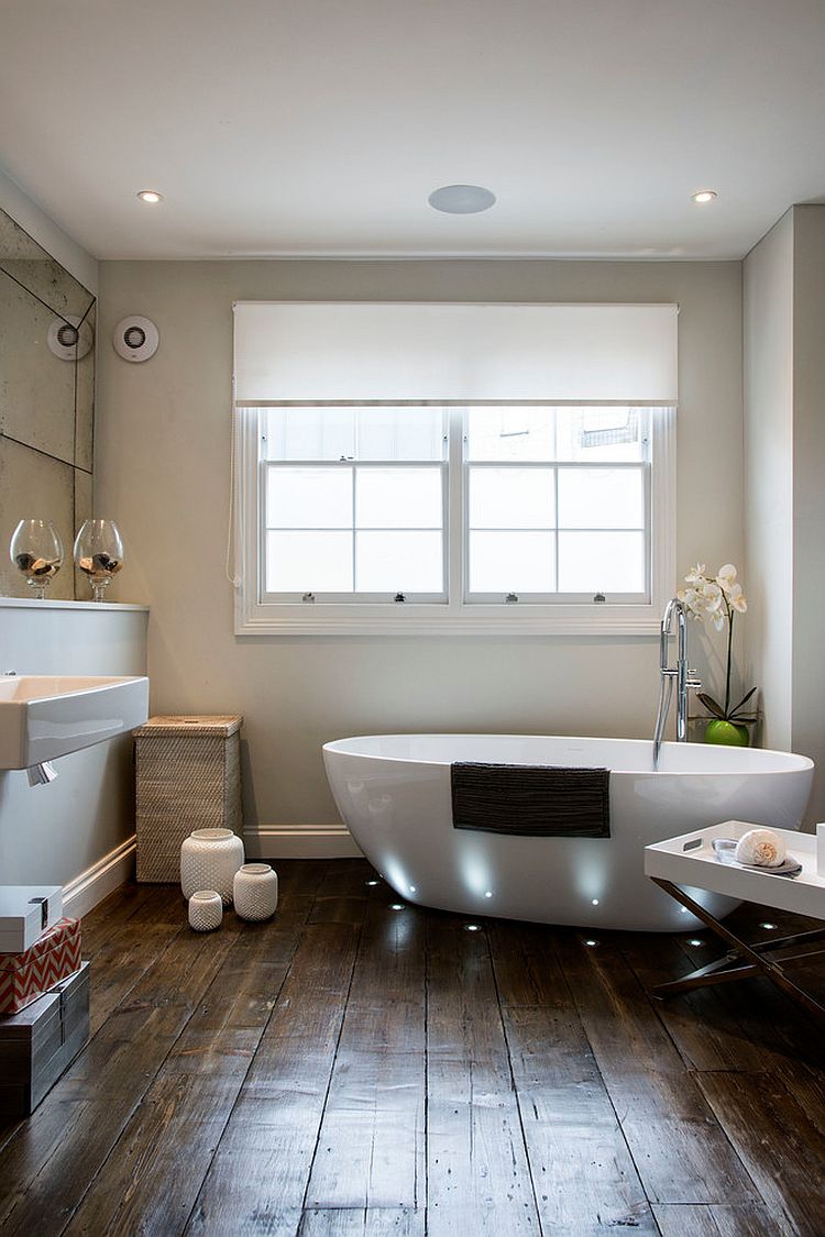 Smart lighting highlights the bathtub while giving the bathroom a spa-styled ambiance