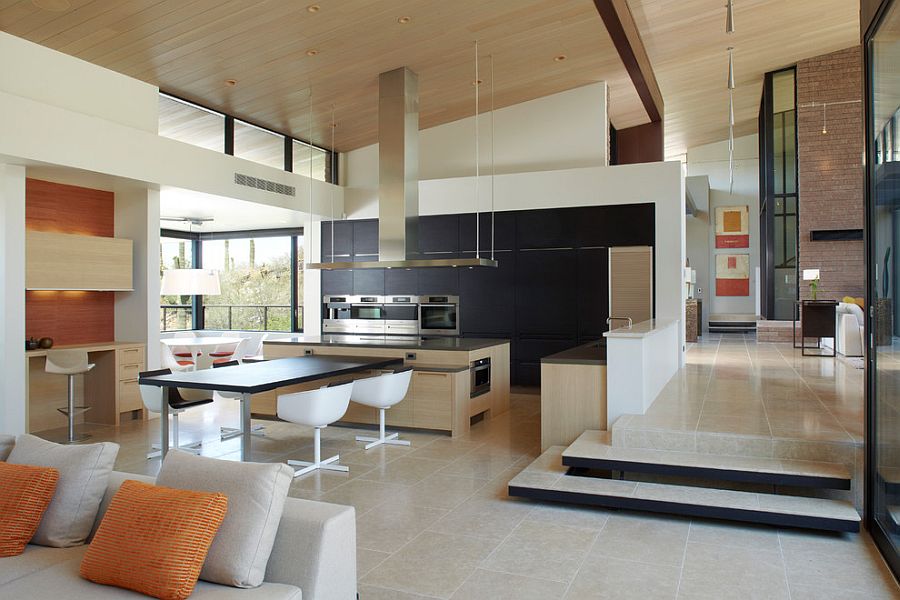 Spacious dining area and kitchen with series of internal steps dividing space