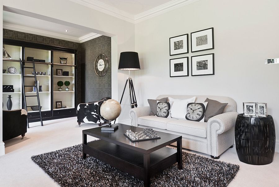 Spacious, monochromatic home office with large shelves and a ladder