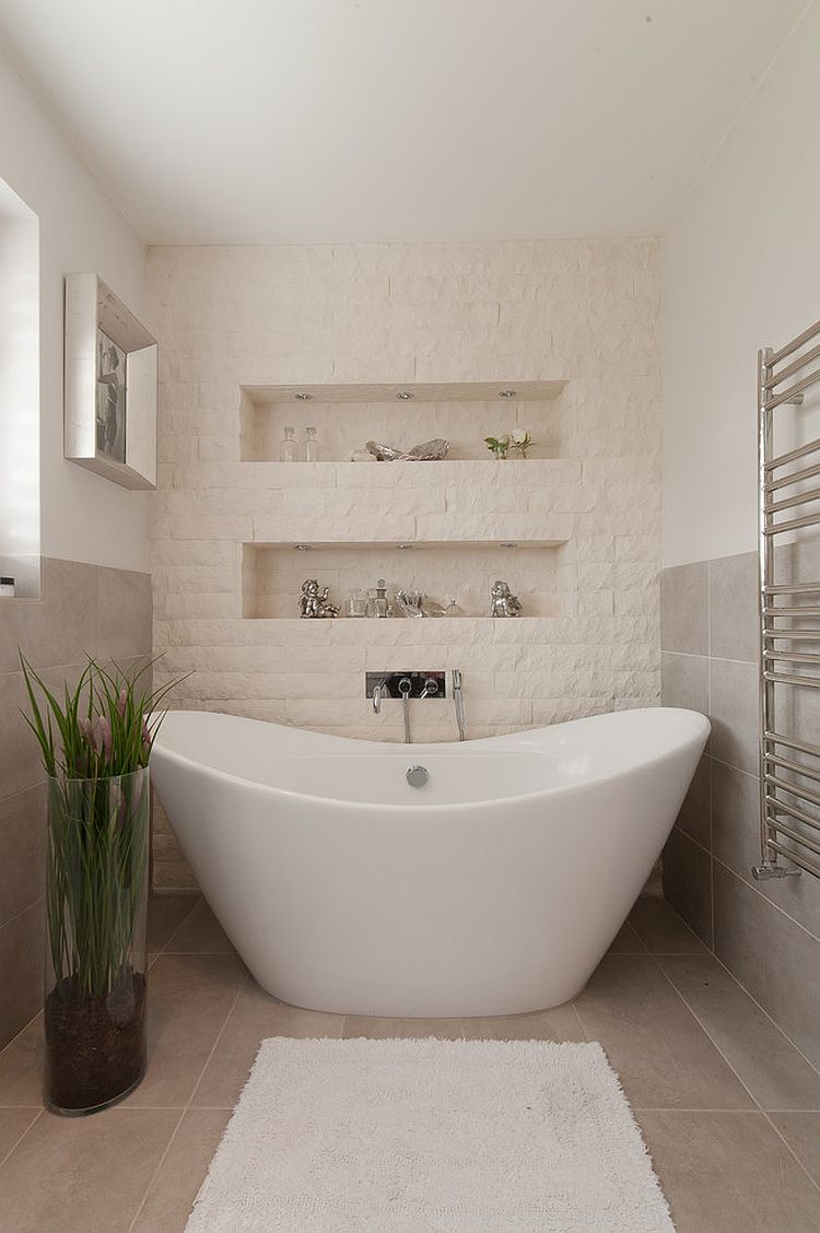 Split-face stone tiles create a textural accent wall in the bathroom