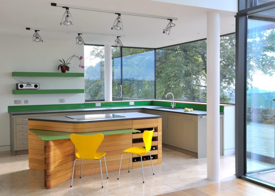 Spotlights in a kitchen with green accents