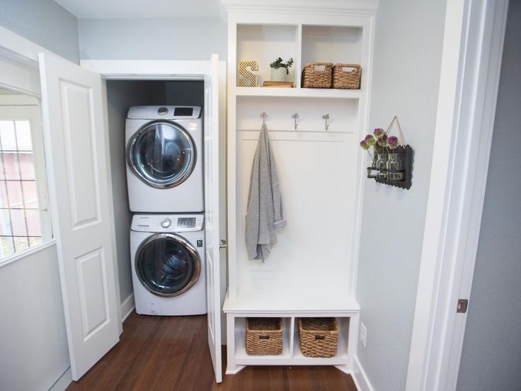 Stacked washer and dryer in entryway closet