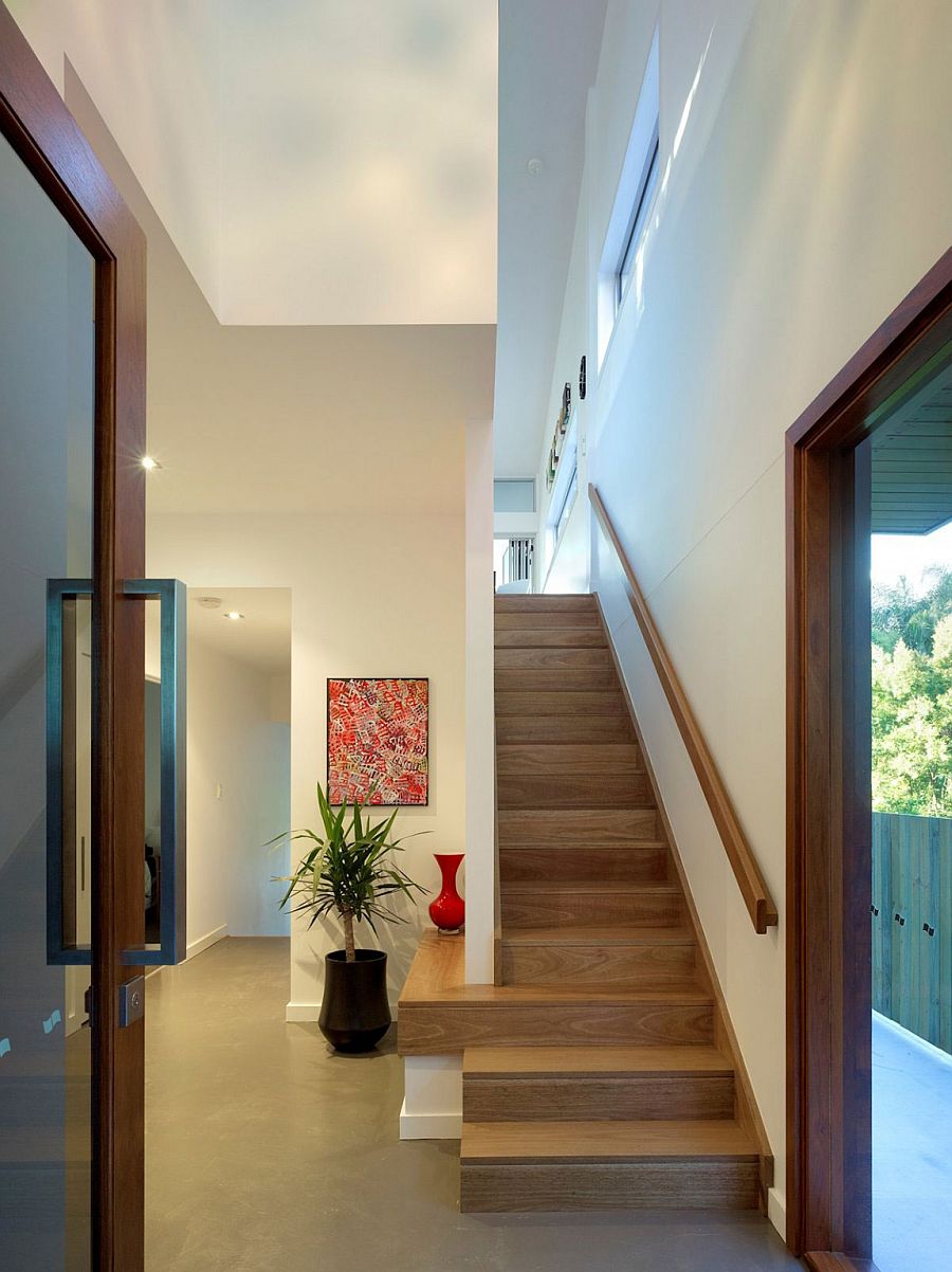 Staircase leading to the top level with bedrooms and additional living area