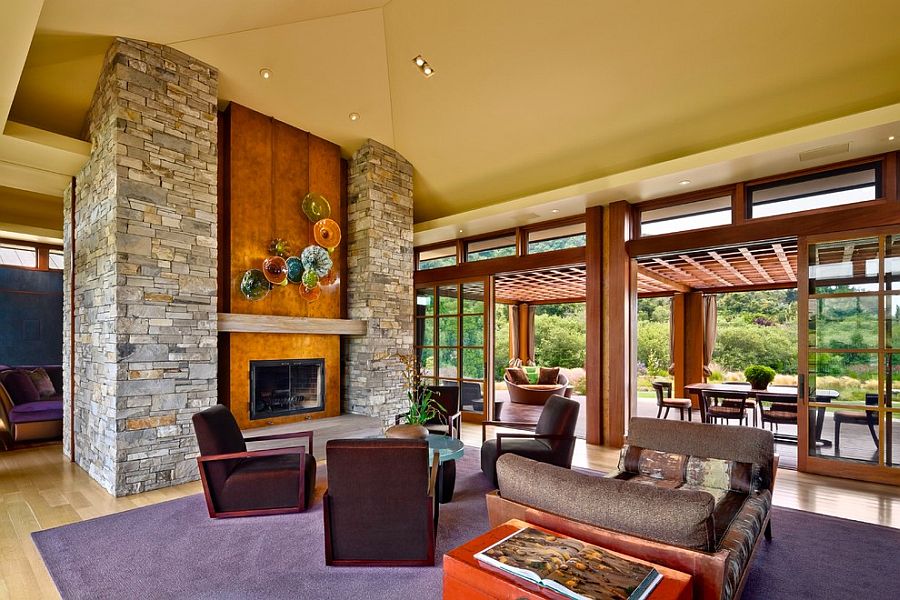 Stone and wood fireplace in the living room becomes the focal point of the modern home