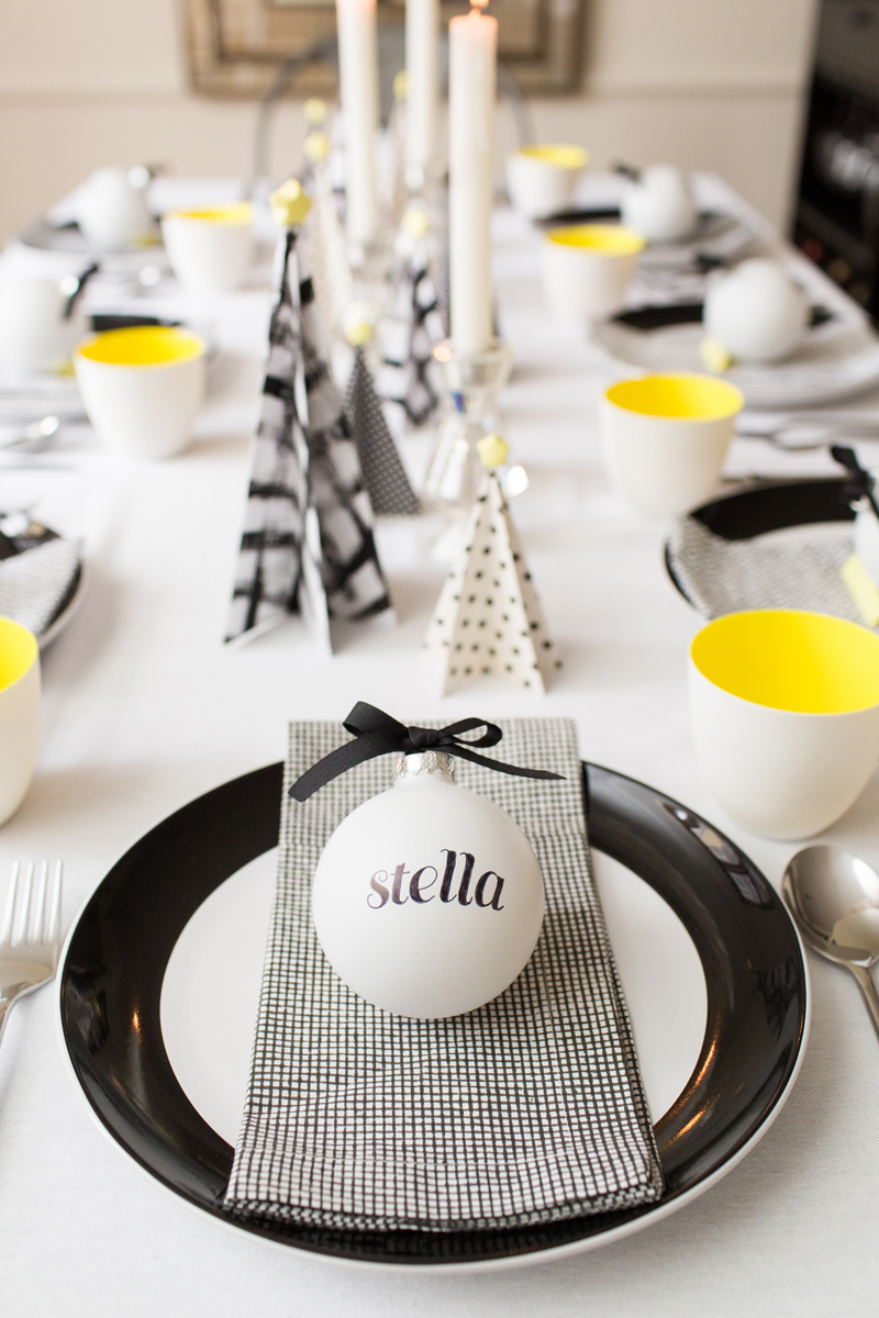 Tablescape with personalized ornaments and paper Christmas trees
