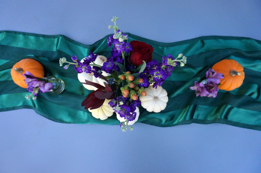 Thanksgiving centerpiece with flowers and pumpkins