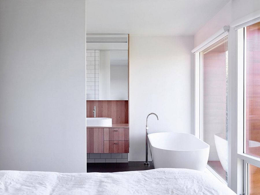 Top level bedroom and bathroom draped in white